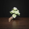 A white artificial rose bouquet simulating preserved flowers for wedding decoration and living room ornaments details Picture